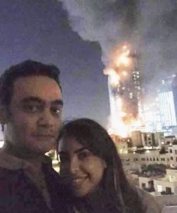 selfie with burning Dubai hotel